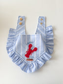 Dog Bandana featuring Lobster Club design with ruffles and button closure, perfect for stylish pups.