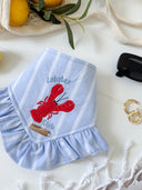 Dog Bandana featuring Lobster Club design with red lobsters and ruffles on a light blue fabric.