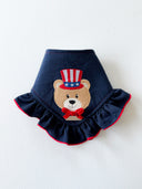 Dog Bandana with Patriotic Teddy design featuring a ruffled edge and embroidered details for festive occasions.