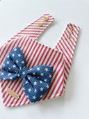 Dog Bandana with stars and stripes design featuring a blue bow tie and adjustable snaps